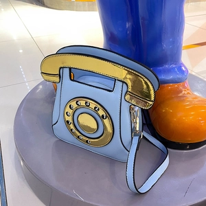 Quirky light blue retro telephone crossbody bag with gold dial and handset detail