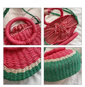 Detail view of watermelon straw bag showing woven texture and red checkered drawstring liner
