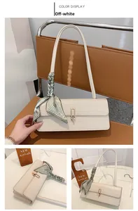 Detail of off-white stone texture shoulder bag with gold clasp and silk scarf decor