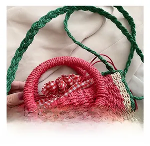Close-up of watermelon straw bag showing round handle and red checkered lining