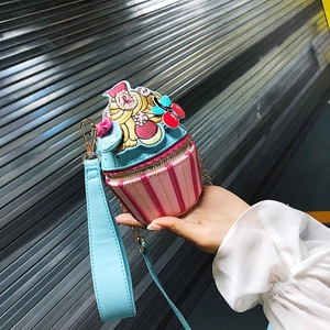 Creative pink striped cupcake shaped crossbody bag with colorful cherry embroidery detail