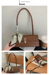 Brown baguette bag with crocodile texture, metal buckle and silk scarf detail