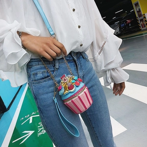 Mini cupcake cross-body bag in blue and pink stripe design with gold chain strap