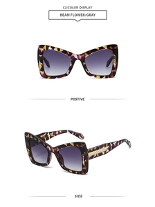 Detail of oversized polygon sunglasses with bean flower frame and gray gradient lenses