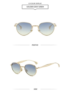Détails de lunettes de soleil rondes dorées avec verres dégradés bleu et jaune