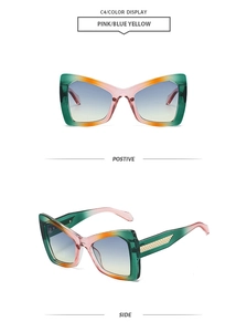 Detail of pink gradient polygon sunglasses with golden woven texture hinge and blue lenses