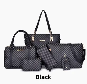 Detail view of 6-piece black handbag set featuring grey geometric prints and gold hardware