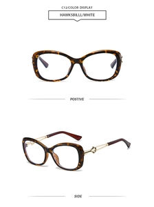Detail view of tortoiseshell butterfly frames with golden metal hollowed-out temples