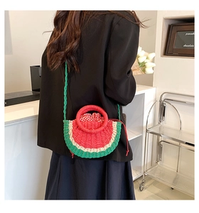 Macro detail of watermelon straw bag with red plaid lining and drawstring closure