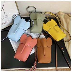 Detailed view of elephant-shaped mini crossbody phone bags in various pastel colors