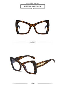 Detail view of tortoiseshell cat-eye sunglasses with gold textured metal temples