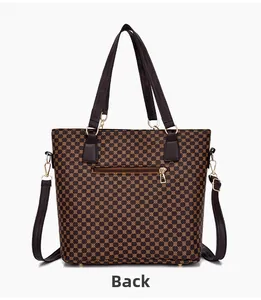 Detail of the vintage print handbag back view featuring a brown leather zipper pocket