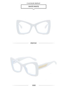 Detail view of white cat-eye sunglasses with luxury gold woven metal temple decor