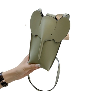 Elephant-shaped leather phone bag in pale green with detailed 3D ears and trunk