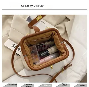 Top view of brown vintage shell bag interior showing large capacity for makeup and gadgets