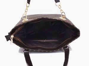 Top view of brown monogram tote bag interior with zipper pockets and gold chain