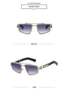 Detail of silver steampunk sunglasses featuring purple gradient lenses and mechanical arms