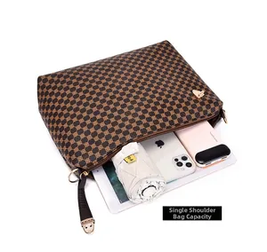 Detailed interior of large capacity shoulder bag showing iPad, phone, and daily essentials