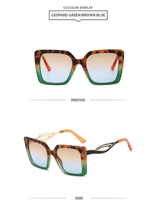 Detail of square oversized sunglasses C6 with leopard frame and green blue gradient lenses