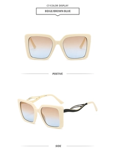 Detail of beige square oversized sunglasses with brown-blue gradient lenses and wave temples