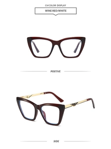 Detail showing wine red cat eye frame with gold metal temples and geometric engraving