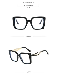 Detail view of square black frame glasses with blue light lenses and gold hollow temples