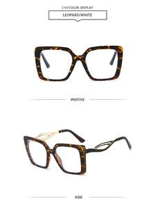 Detail of leopard print square frames with gold hollow metal temples and white accents
