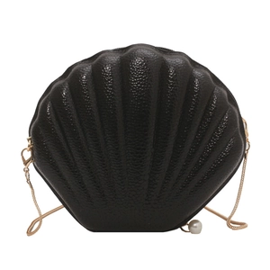 Chic black shell-shaped crossbody bag with gold chain strap and pearl pendant detail