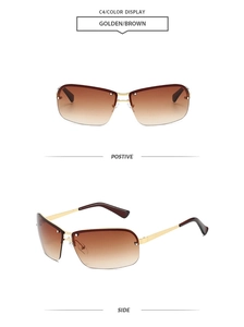 Détail de lunettes de soleil ovales demi-cerclées dorées avec verres marron dégradés