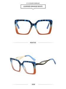 Detail view of square leopard orange and blue gradient eyewear frames with golden temples