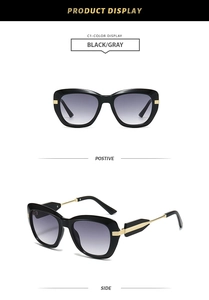 Front and side views of vintage polygonal sunglasses in black and gray with gold accents
