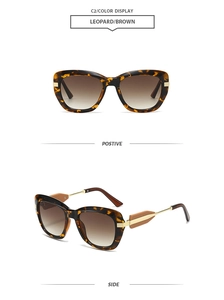 Detail view of leopard print oversized sunglasses with gold metal hinges and brown lenses