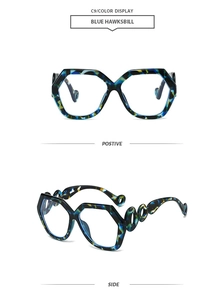 Detail view of blue hawksbill geometric sunglasses with hollow ring chain temple design