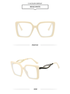 Detail of square beige glasses frame with golden metal hollow temples and black tips