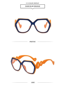 Detail view of stylish dark blue and orange hexagonal sunglasses with wavy hollow temples