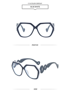 Detail of blue and white hexagonal sunglasses with unique cutout ring chain temples