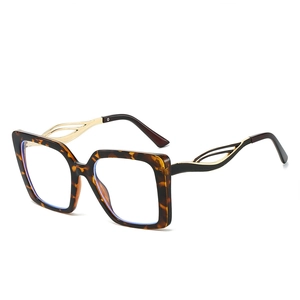 Classic square tortoiseshell sunglasses with hollow gold metal temples on white background