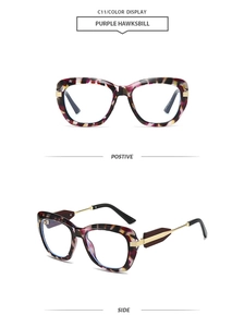 Detail view of purple hawksbill polygon sunglasses with slim gold metal temples