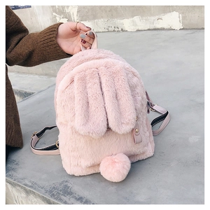 Detailed view of the pink fluffy rabbit backpack with soft long ears and furry ball tail