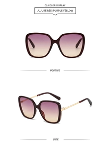 Detail view of square jujube red sunglasses with gradient purple and yellow lenses