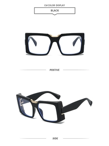 Detail of square black sunglasses with gold metal hinges and light blue lenses