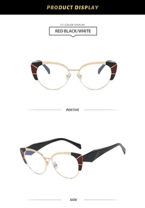 Dettaglio montura occhiali cat-eye con blocchi di colore geometrici rossi e neri
