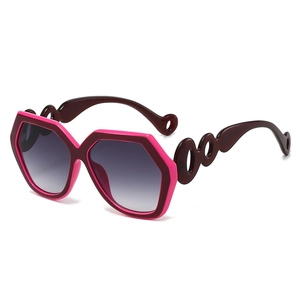 Fashionable oversized polygonal sunglasses with pink frame and chain-style hollow temples