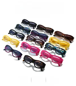 Detailed view of colorful thick frame cat-eye sunglasses with various trendy patterns