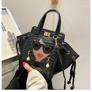 Detail of crocodile pattern handbag with sunglasses, red lips and pearl earring decor