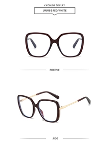 Detail of square oversized frames in jujube red with gold metal temples side view