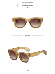 Detail view of square tortoiseshell sunglasses with brown gradient lenses and resin frame