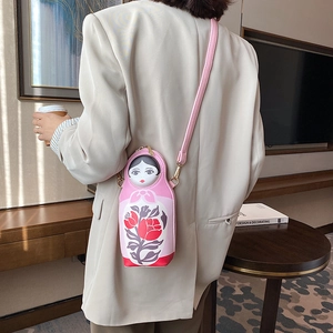 Creative Russian nesting doll PU crossbody bag with pink floral print on a model