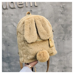 Detail of plush bunny backpack with soft faux fur texture and long rabbit ears