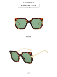 Detailed views of tortoiseshell irregular oversized sunglasses with green lenses